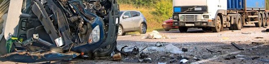 A crashed car in the road after and accident