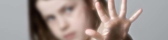 Child holding up hand