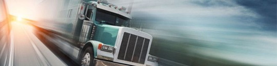 A green big rig truck